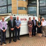 Axis employees working on the new Melton BC contract stood infront of Axis branded van.
